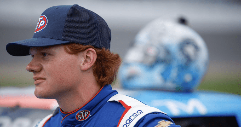 Thad Moffitt looks on